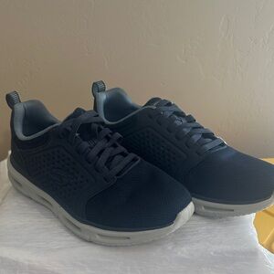 Skechers Men's Dark Blue and Light Gray Sneakers. Glide -Lite, classic fit.